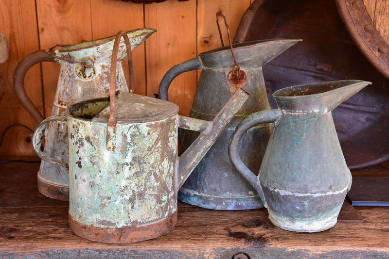 Collection of four antique French watering cans