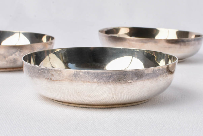 Vintage silver-plated bowls with embossed badges