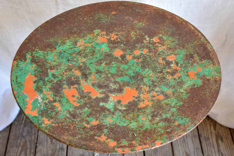 Rustic French garden table with weathered green and orange patina