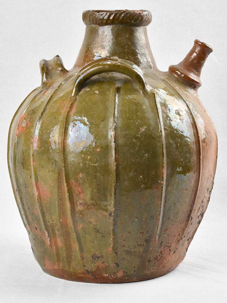 Antique French walnut oil jar with green patina 17¼"