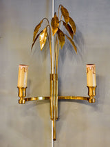 Pair of Maison Charles wall sconces with gold bay leaves