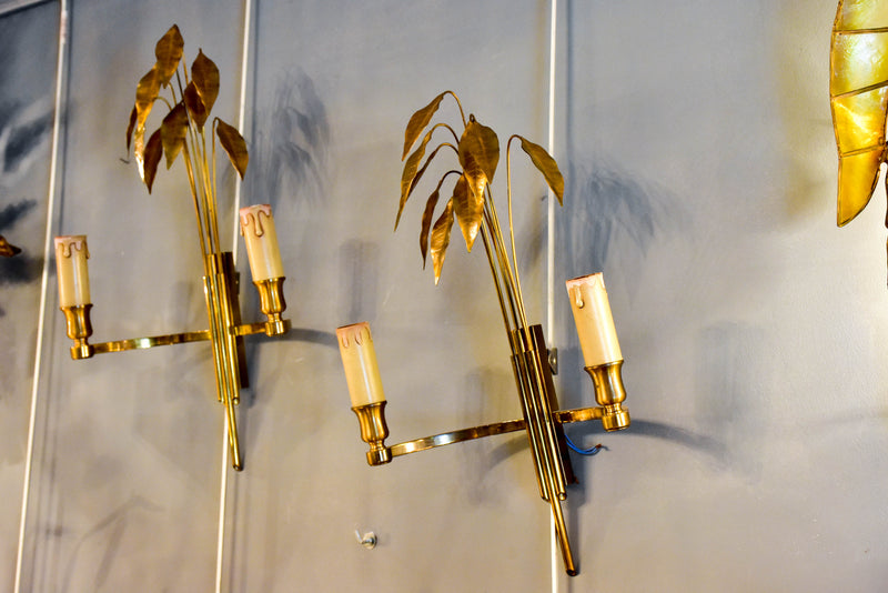Pair of Maison Charles wall sconces with gold bay leaves