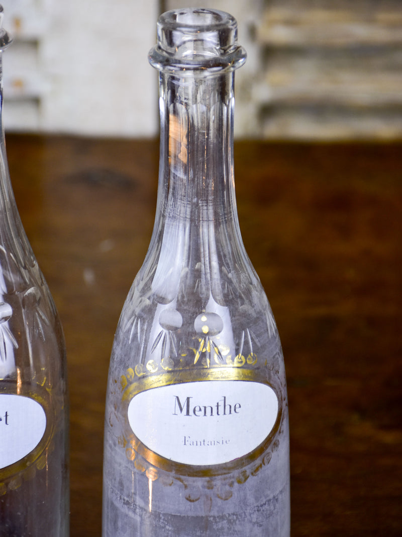 Three antique Parisian bistro bottles - signed