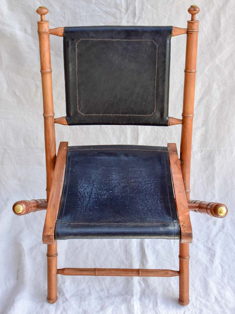 Four antique French colonial folding leather boat deck chairs