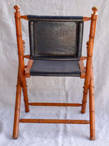 Four antique French colonial folding leather boat deck chairs