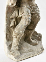 Propped old warrior stone sculpture