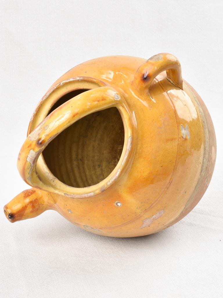 Glazed yellow early-twentieth-century French jug
