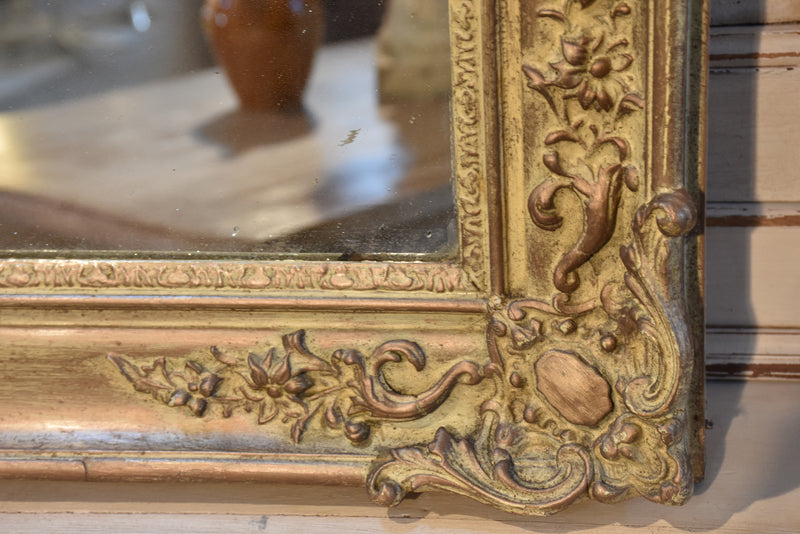 Antique French mirror with decorative frame