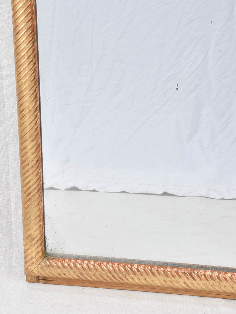 Louis XVI gilded mirror with spiraling frame 32¾" x 57"