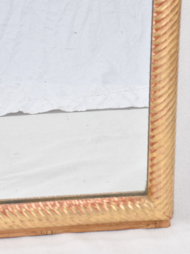 Louis XVI gilded mirror with spiraling frame 32¾" x 57"