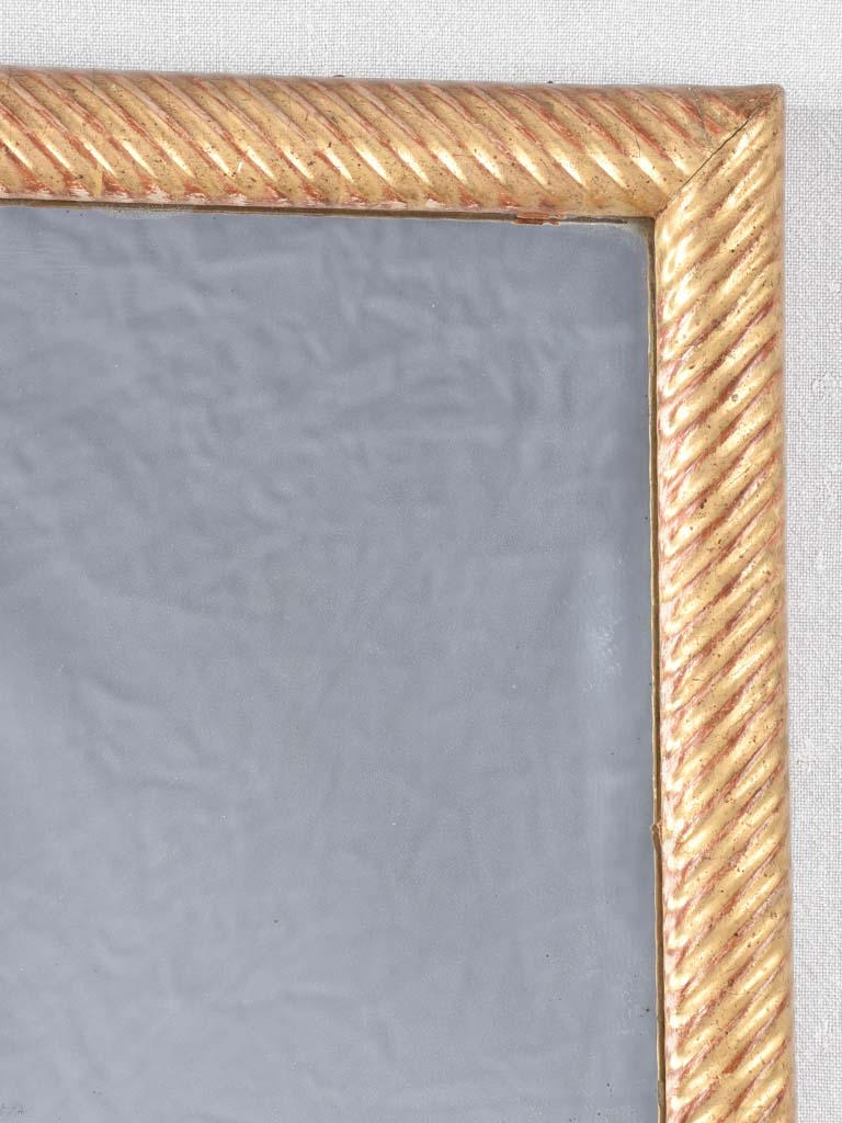 Louis XVI gilded mirror with spiraling frame 32¾" x 57"