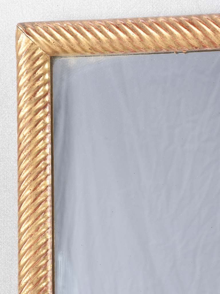 Louis XVI gilded mirror with spiraling frame 32¾" x 57"
