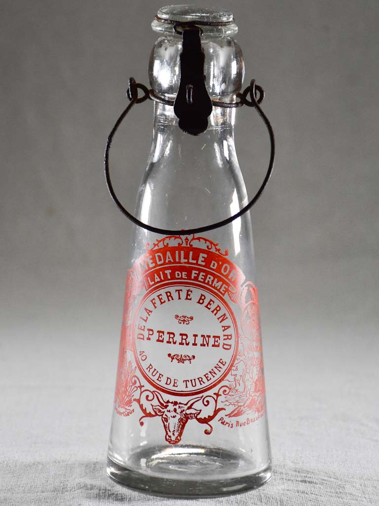 Antique French milk bottle with red transfer label 9¾"