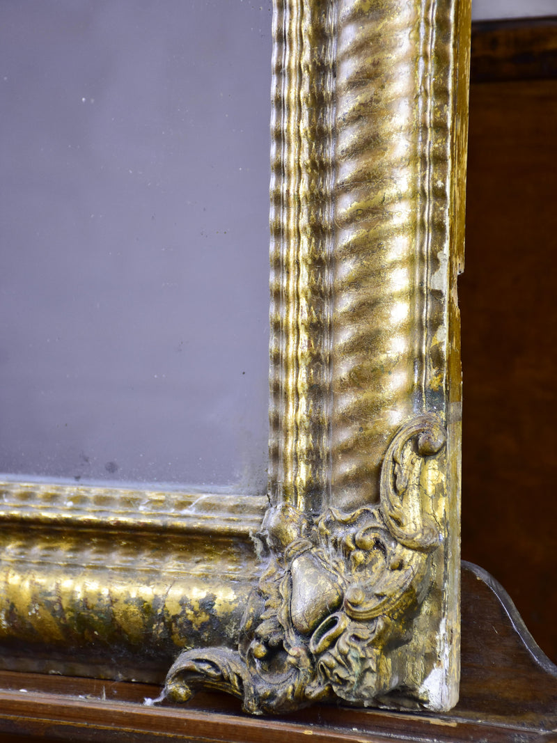 Antique French mirror with gold gadrooned frame