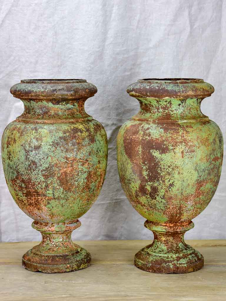 Pair of 19th Century cast iron garden urns with timeworn green patina 16¼"