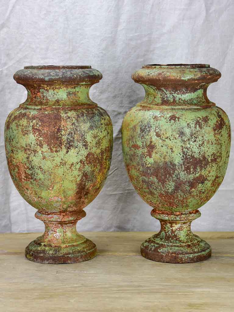 Pair of 19th Century cast iron garden urns with timeworn green patina 16¼"