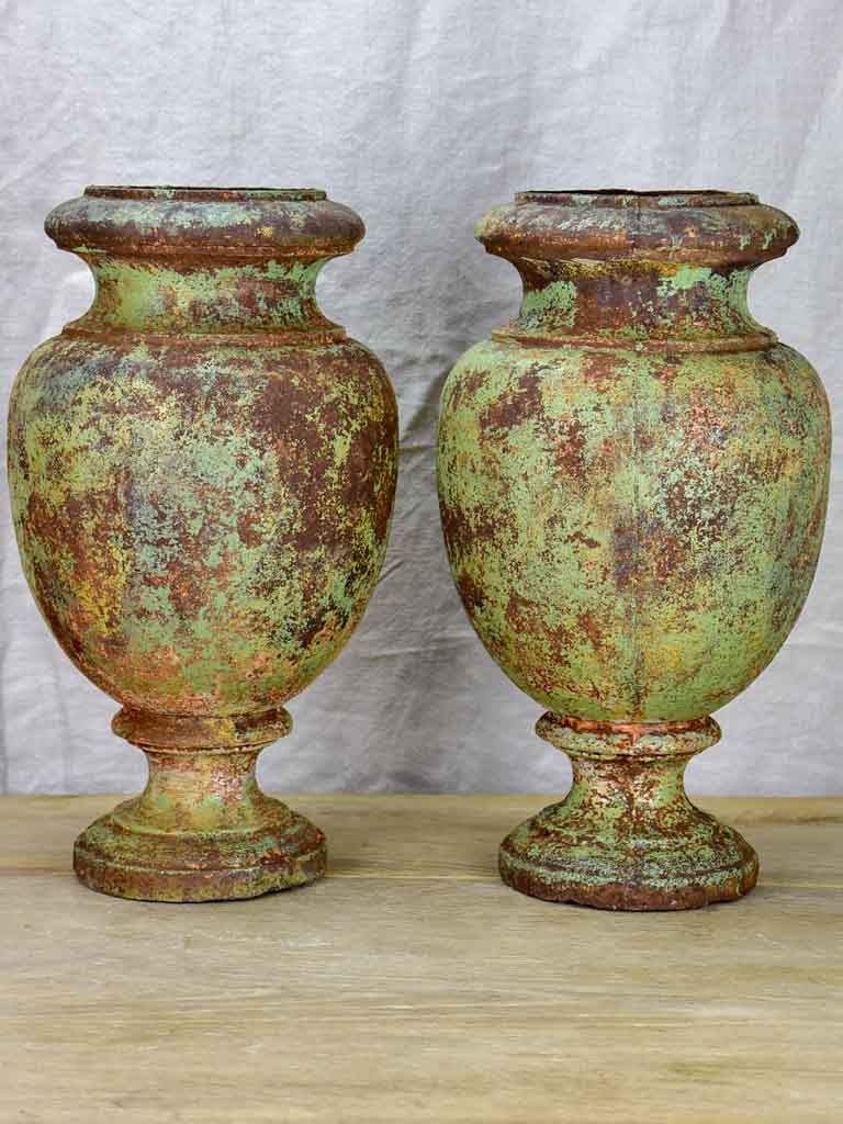 Pair of 19th Century cast iron garden urns with timeworn green patina 16¼"