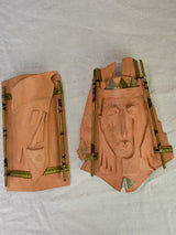 Pair of vintage handmade terracotta tile wall sconces with faces 11¾"