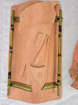 Pair of vintage handmade terracotta tile wall sconces with faces 11¾"