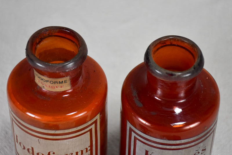 Two late nineteenth-century French apothecary jars with red tin lids 8¼"