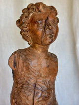18th Century sculpture of a cherub mounted on an iron stand