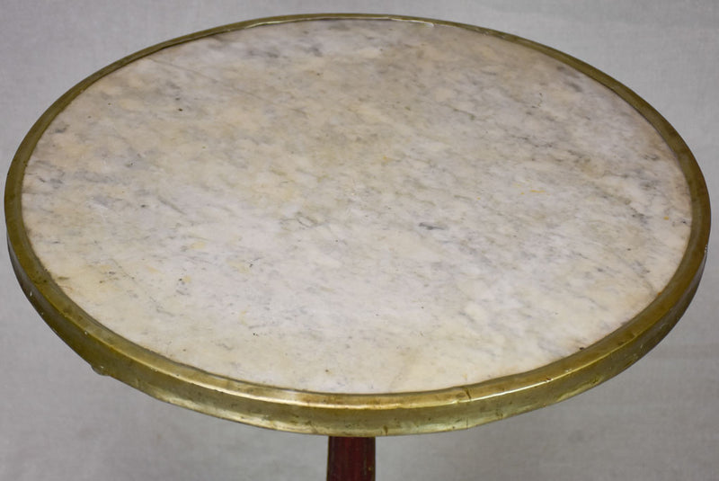 Pretty early twentieth century French bistro table with marble top and cast iron base