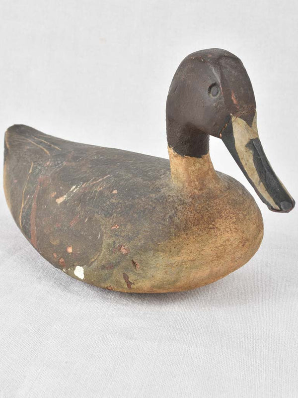 Antique carved wooden farmhouse-style duck decoy