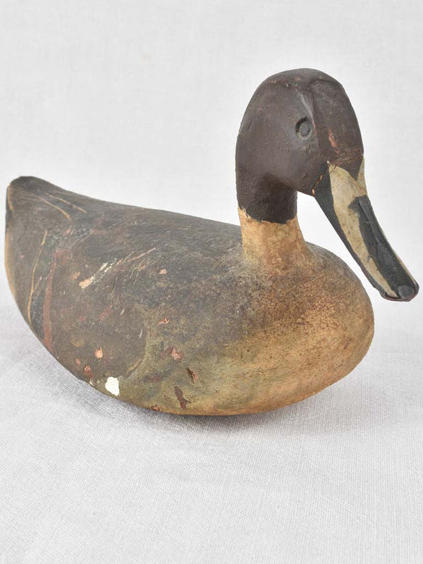 Antique carved wooden farmhouse-style duck decoy