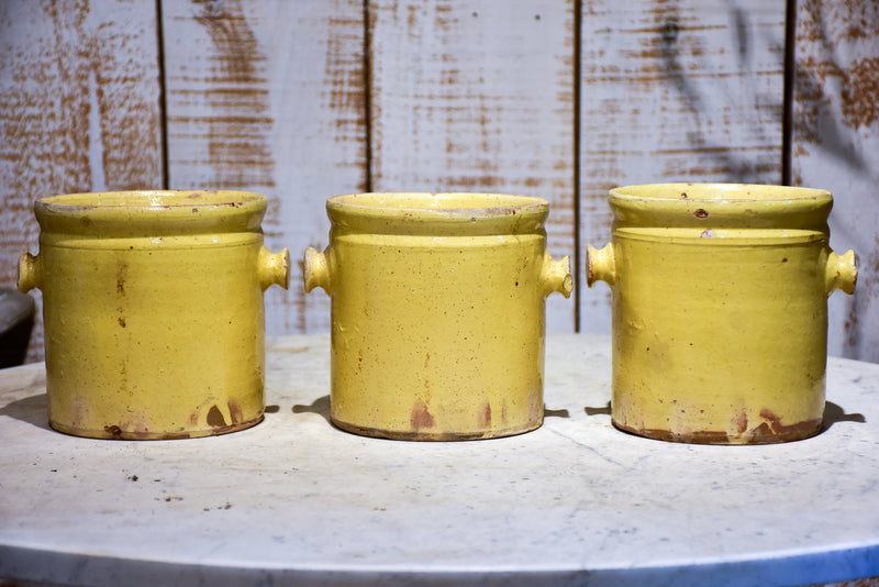 Set of three yellow glazed French pots