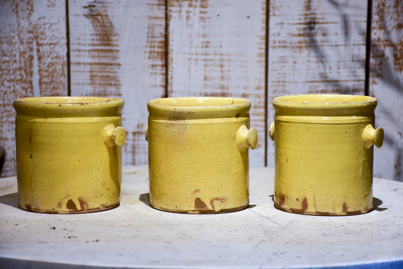Set of three yellow glazed French pots