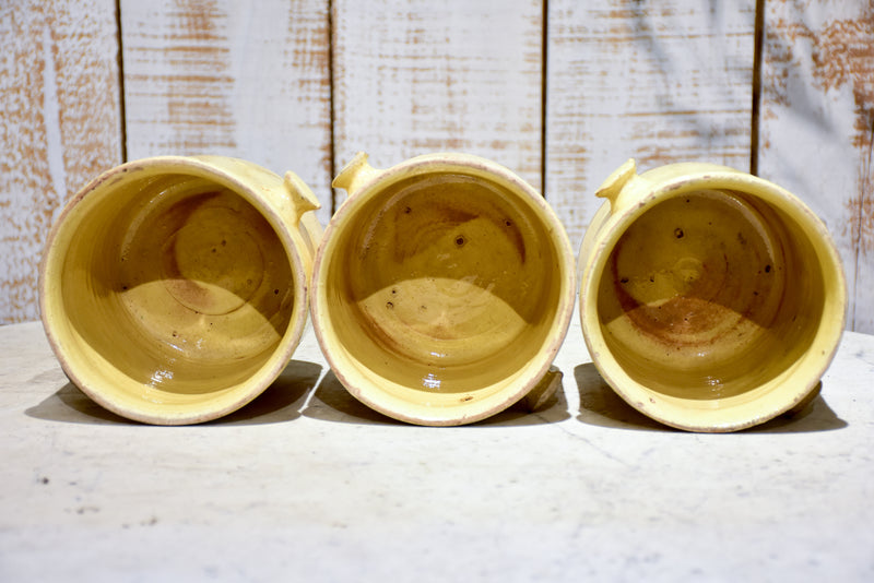 Set of three yellow glazed French pots