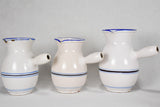 Collection of eight 19th-century white pots with blue stripes from Sète