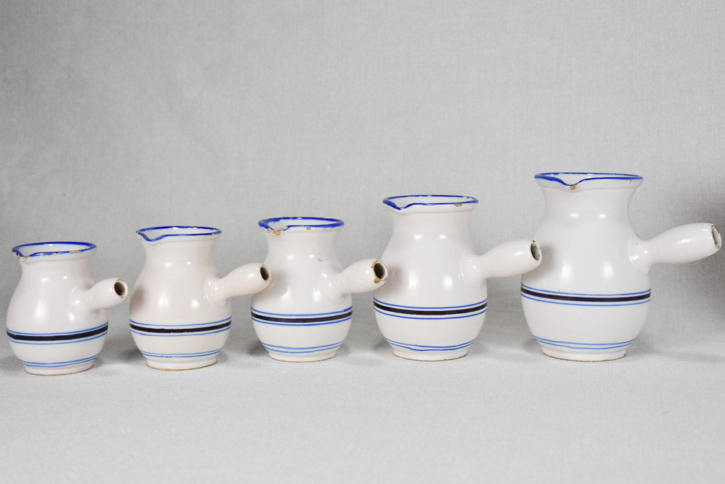 Collection of eight 19th-century white pots with blue stripes from Sète