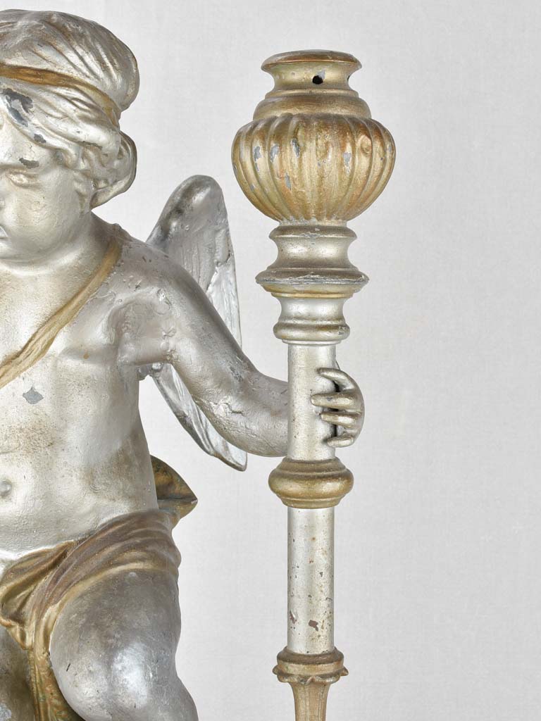 Zinc cherub statue with rustic patina