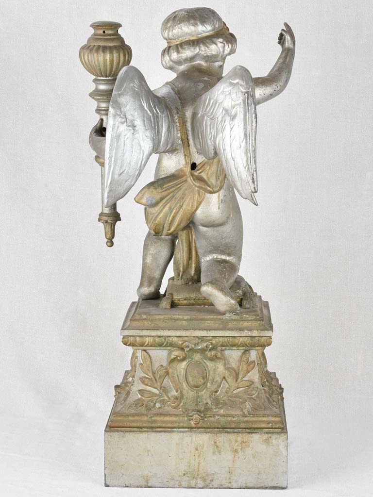 Historic metal statue with torchlight