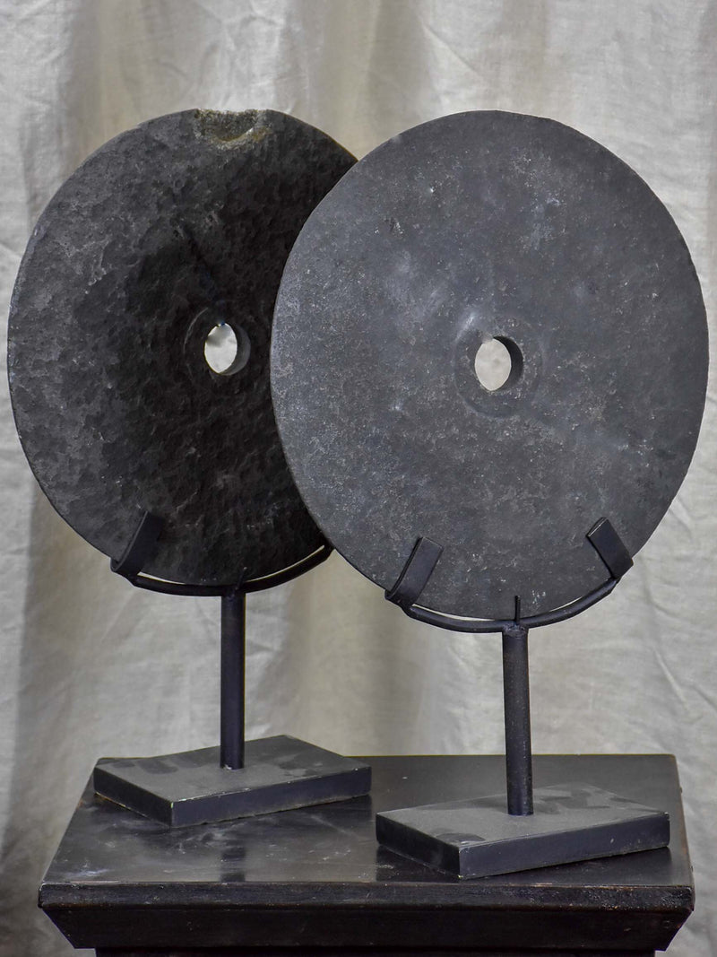 Pair of mounted stone discs from Papua New Guinea