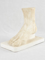 Retro plaster foot molding on base