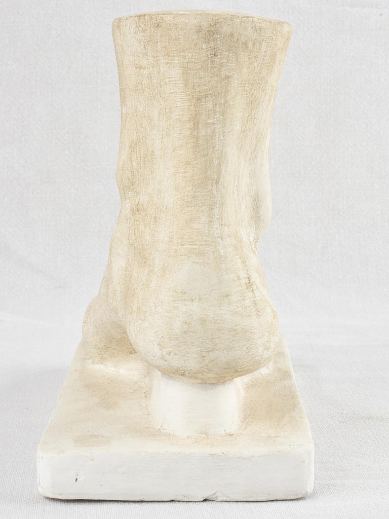 Decorative century-old foot plaster sculpture