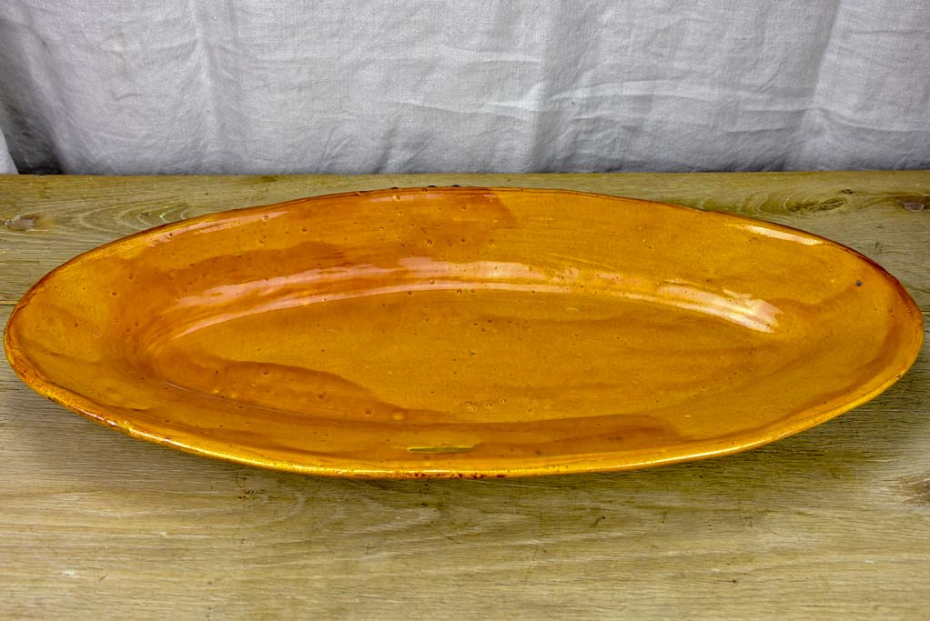 Very large ceramic platter with ochre glaze - Cliousclat Drome 1960's 26"