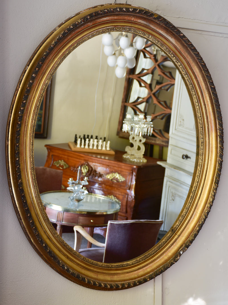 Large oval Louis XVI style mirror
