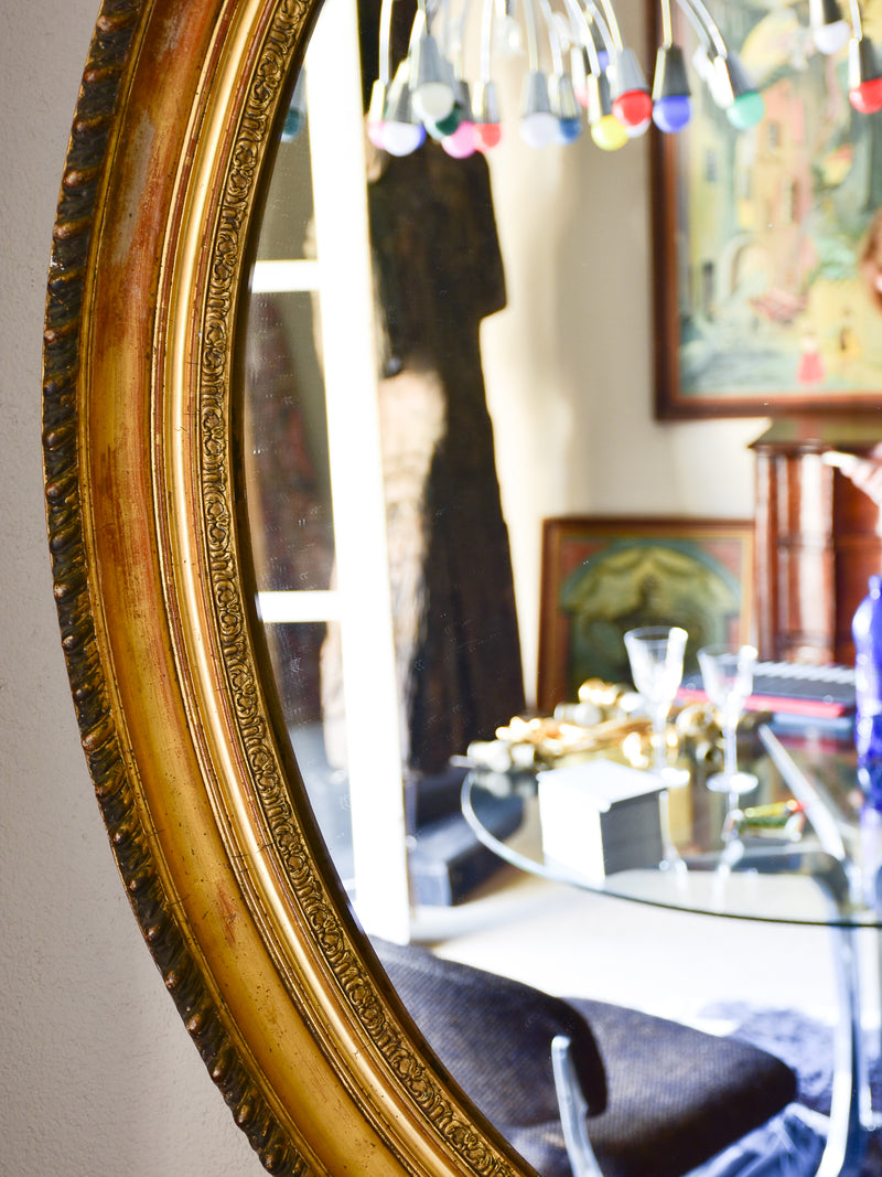 Large oval Louis XVI style mirror