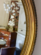 Large oval Louis XVI style mirror