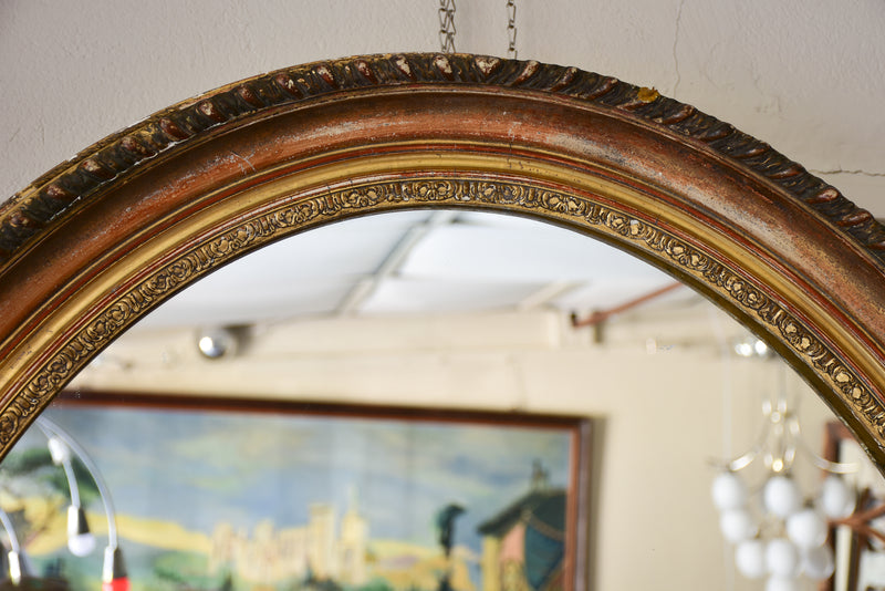 Large oval Louis XVI style mirror