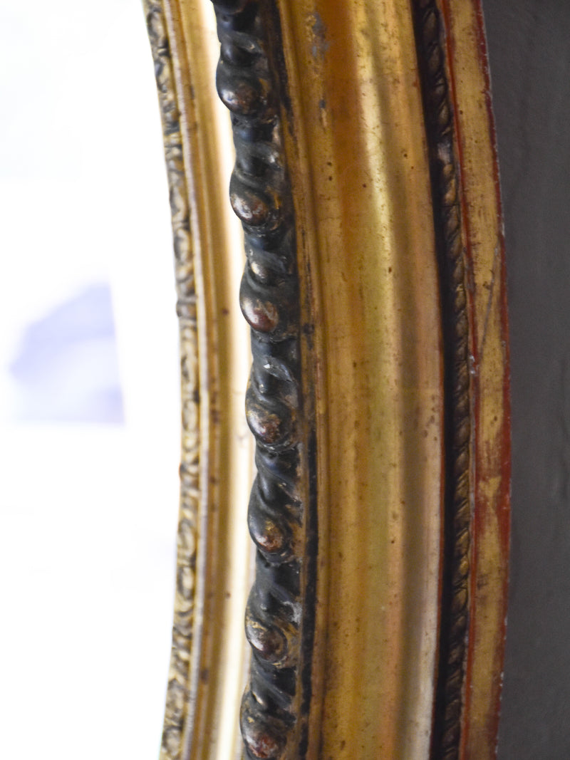 Large oval Louis XVI style mirror