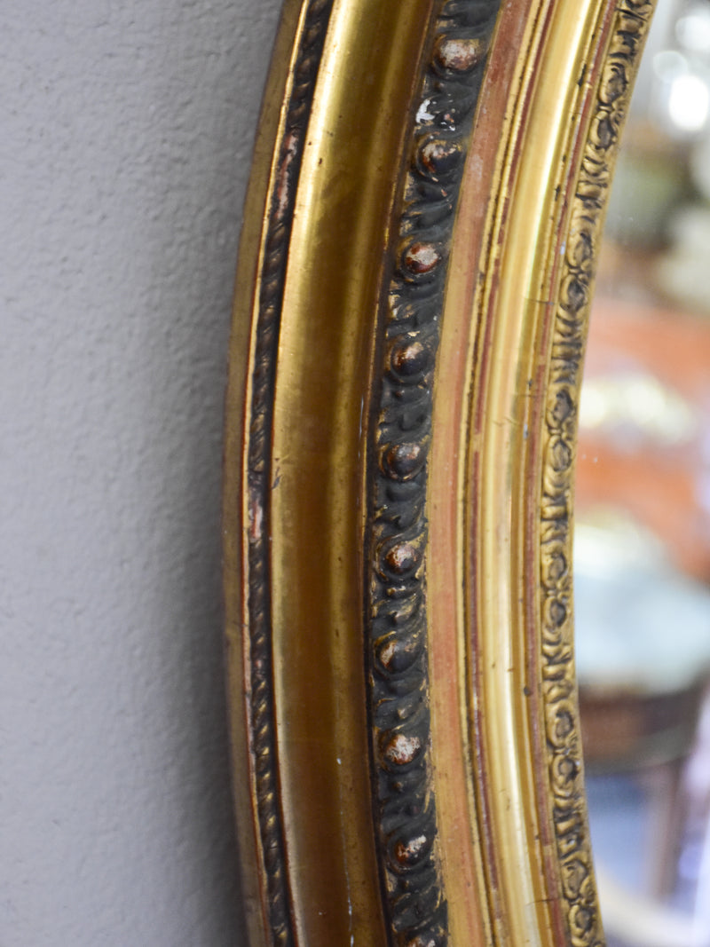 Large oval Louis XVI style mirror