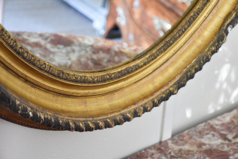 Large oval Louis XVI style mirror