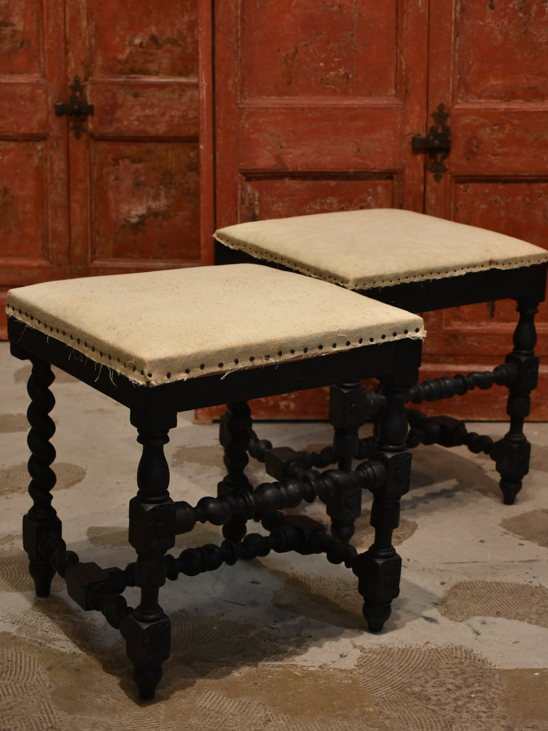 Pair of Louis XIII style stools with black patina