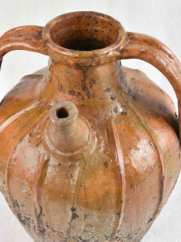 Antique French terracotta walnut oil pitcher from the Auvergne 14¼"