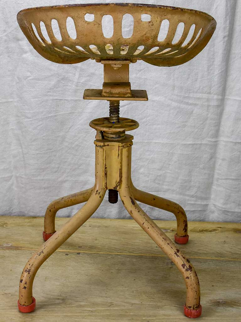 Salvaged antique tractor seat stool with industrial 1930's Flambo base