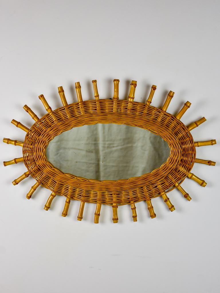 Vintage oval sunburst mirror - rattan and bamboo, 1970's 23¾ x 16¼""